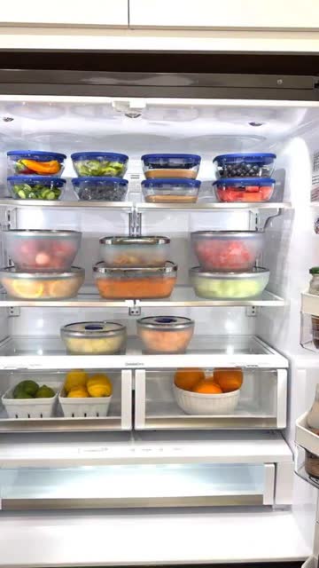 Fridge stocked with meal-prep containers